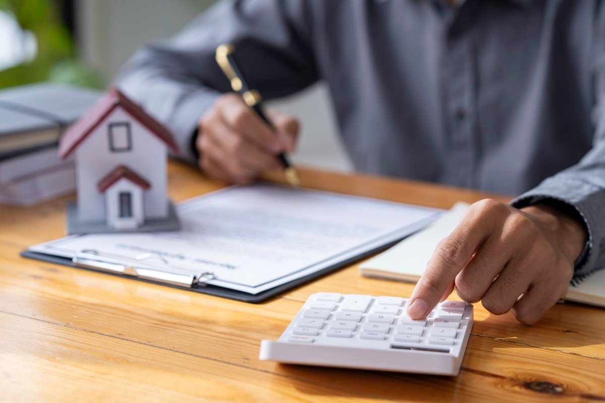 Reviewing a lending agreement, calculator in hand